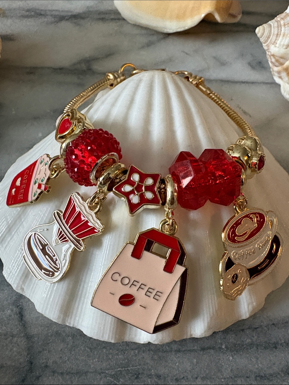 Gold-Tone Bracelet with Red Coffee Charm Accents